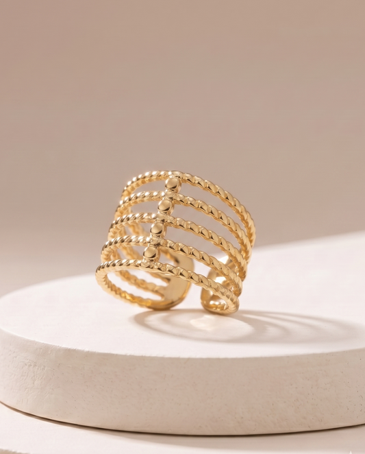 The Twisted Multi-Band Cage Ring