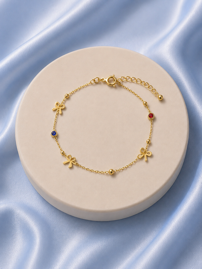 Enchanted Bow & Gemstone Gold Bracelet
